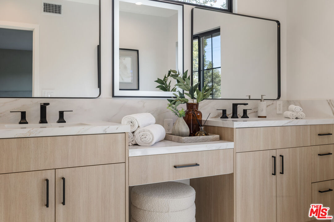 5032 Bluebell Avenue Valley Village, CA 91607 - Photo 49 of 75 a bathroom with a sink and a mirror