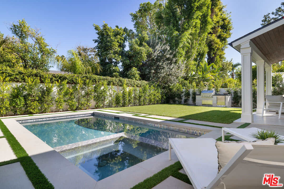 5032 Bluebell Avenue Valley Village, CA 91607 - Photo 56 of 75 a view of yard with swimming pool and outdoor seating