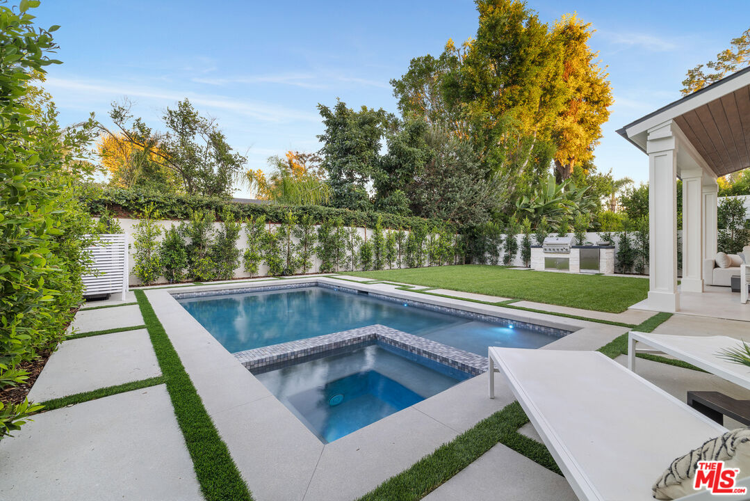 5032 Bluebell Avenue Valley Village, CA 91607 - Photo 59 of 75 a view of backyard with swimming pool and outdoor seating