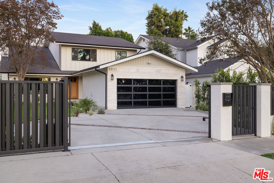 5032 Bluebell Avenue Valley Village, CA 91607 - Photo 64 of 75 a front view of a house with a yard and garage