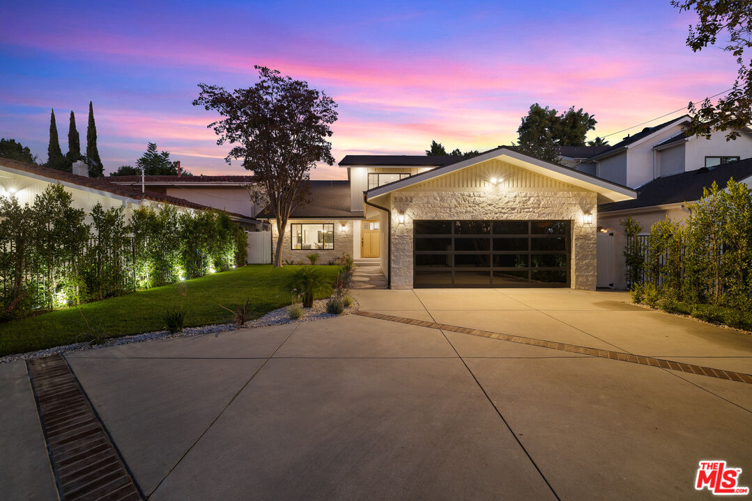 5032 Bluebell Avenue Valley Village, CA 91607 - Photo 66 of 75 a front view of a house with a yard and garage