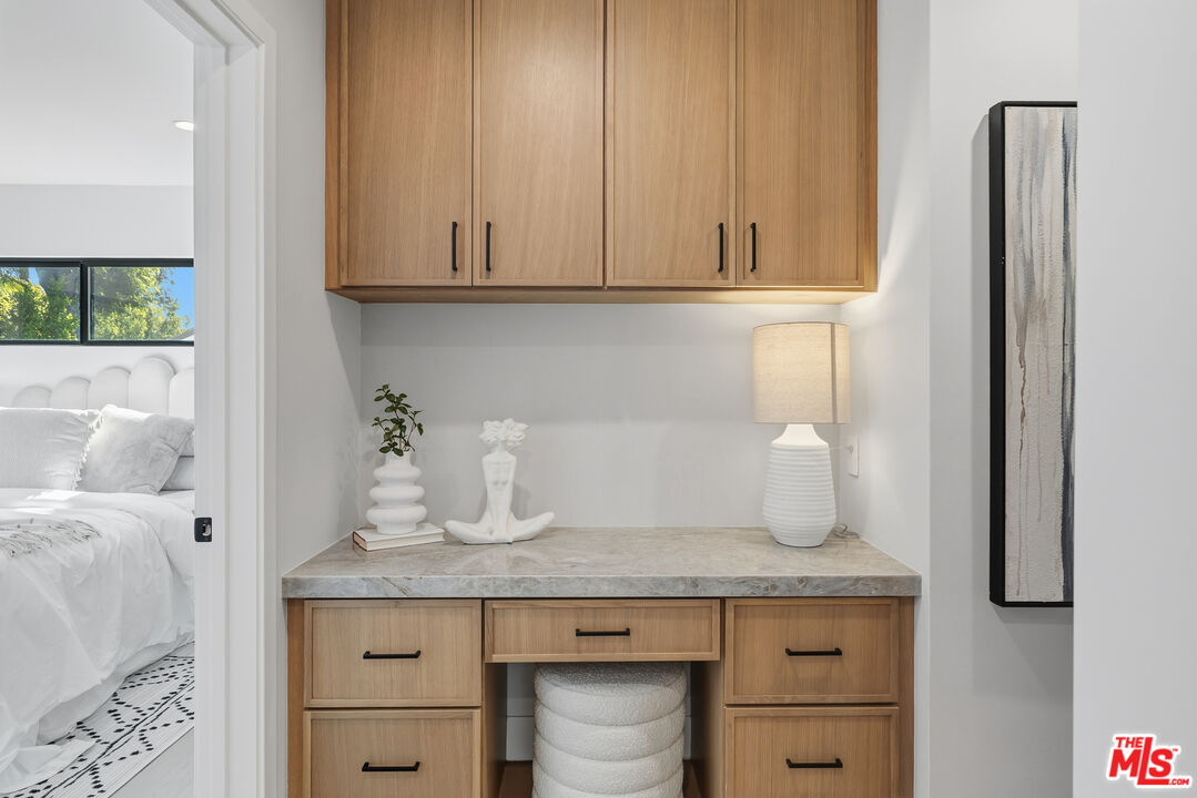5032 Bluebell Avenue Valley Village, CA 91607 - Photo 7 of 75 a bathroom with a granite countertop sink and a mirror