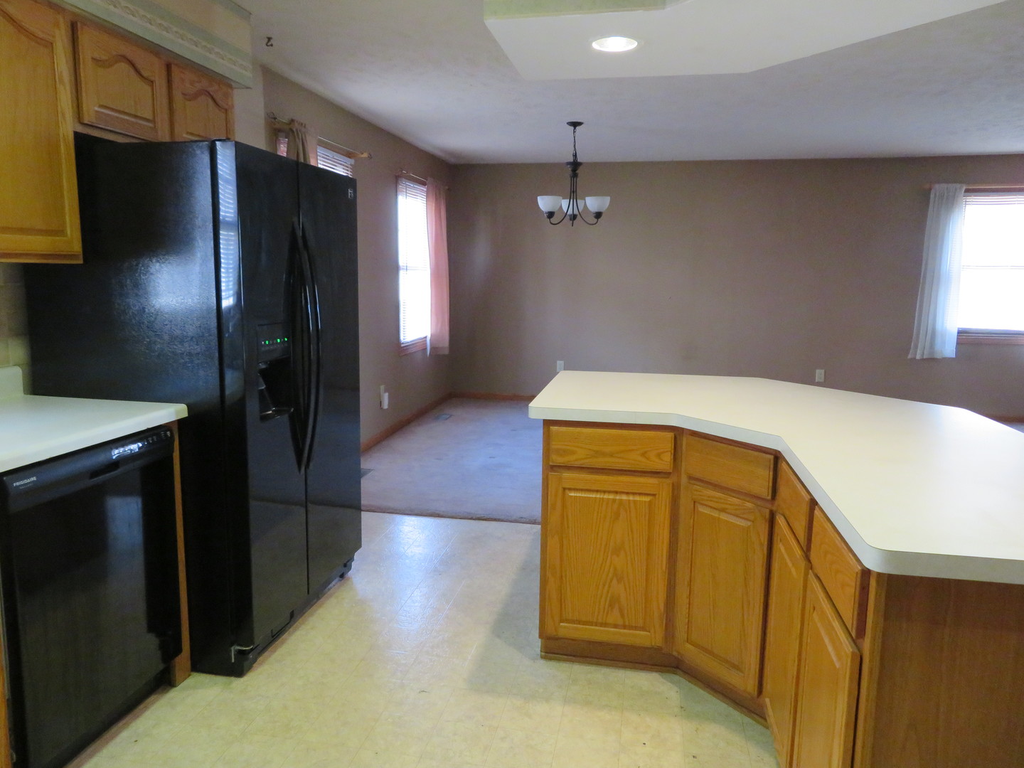 440 South Peace Road, Unit 440 Sycamore, IL 60178 - Photo 2 of 19 a utility room with wooden floor washer and dryer