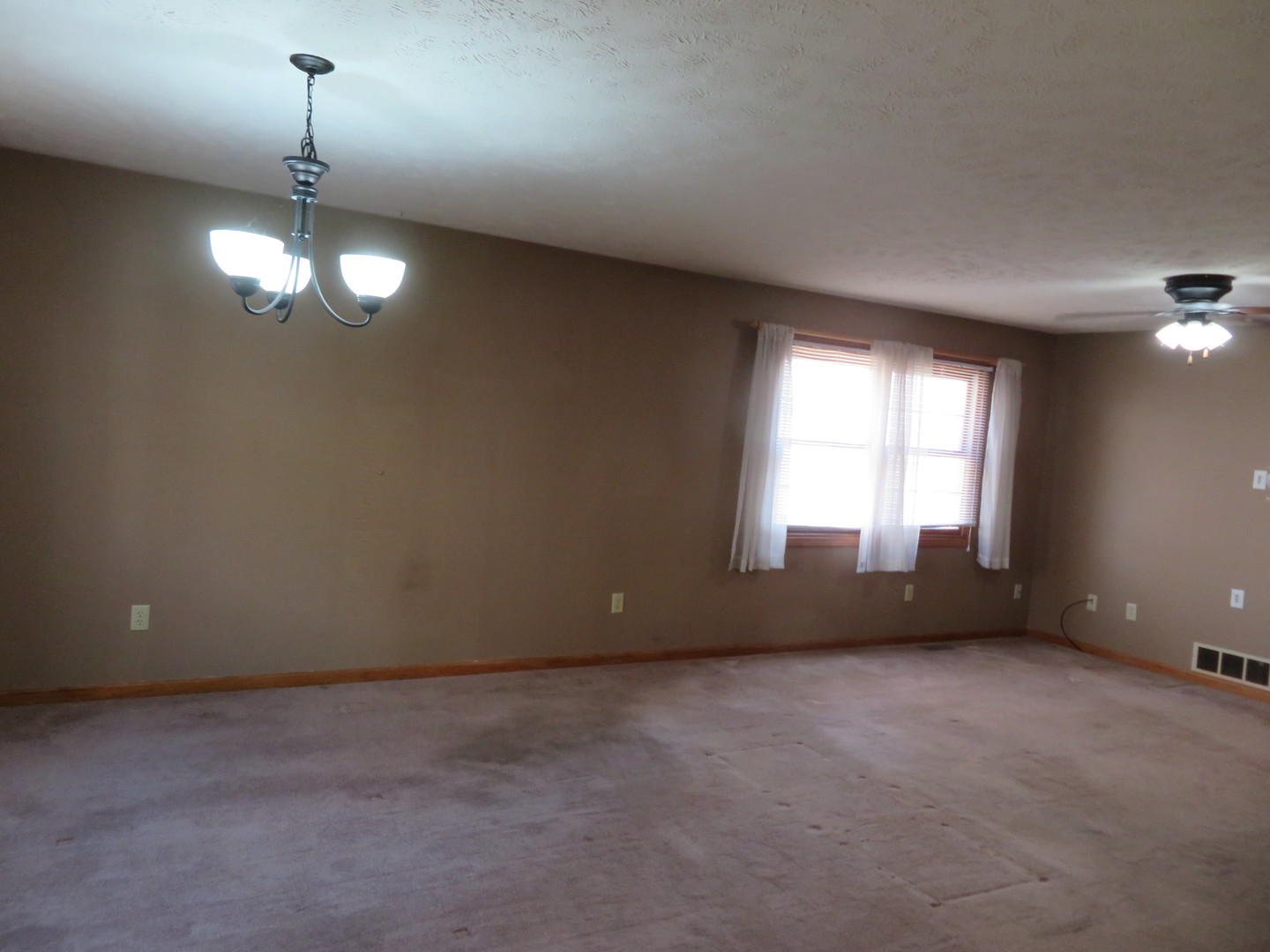 440 South Peace Road, Unit 440 Sycamore, IL 60178 - Photo 7 of 19 a view of an empty room with a window