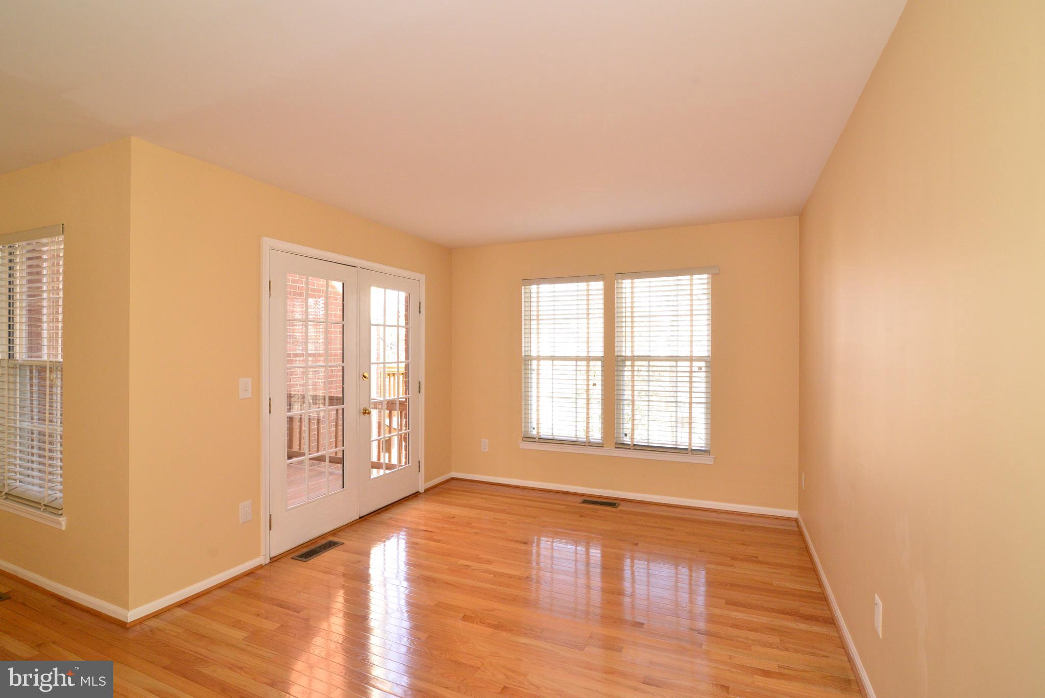 1384 Park Garden Lane Reston, VA 20194 - Photo 12 of 38 The family room area leads to the main level deck.