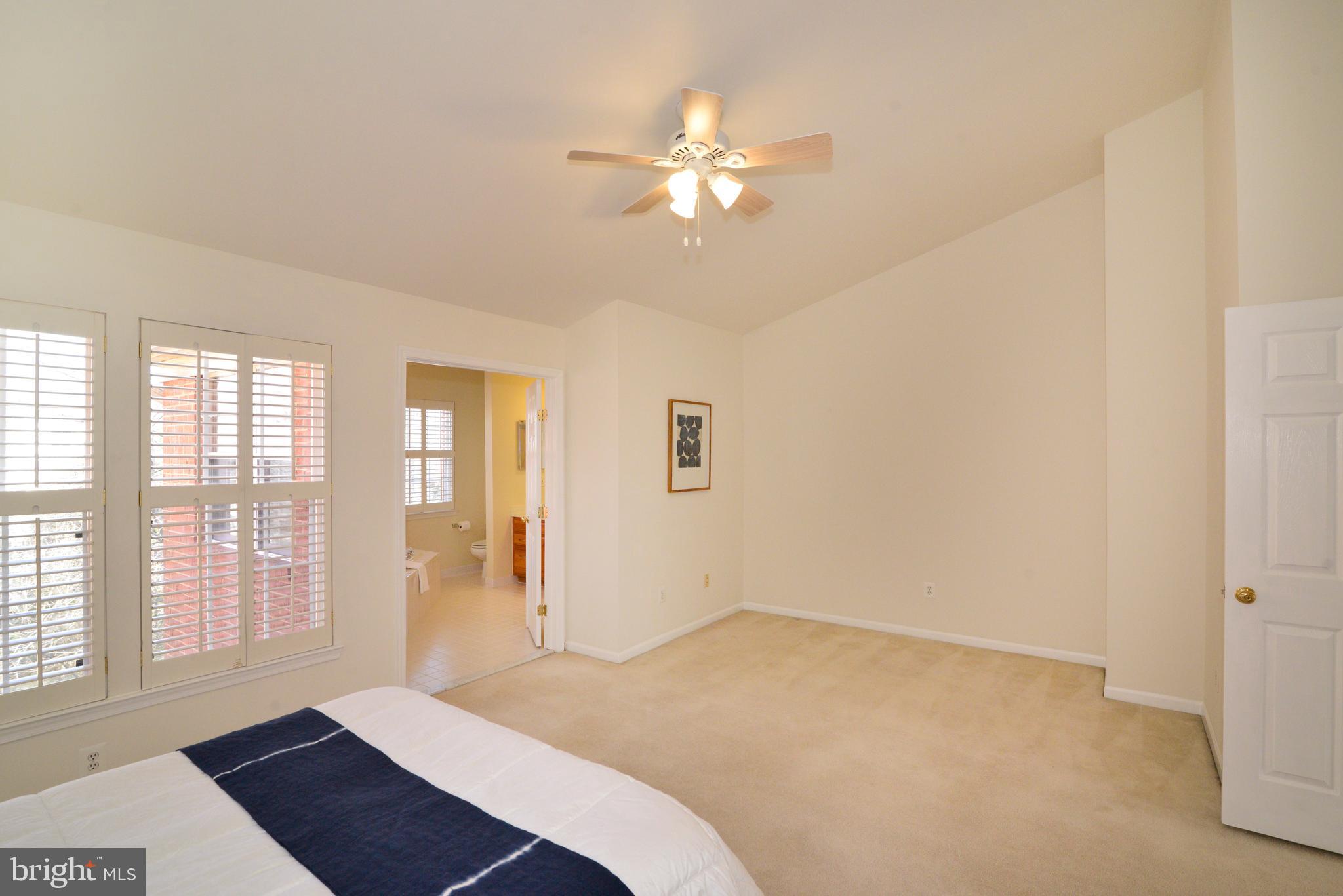 1384 Park Garden Lane Reston, VA 20194 - Photo 20 of 38 The owner's suite has a wall of windows.