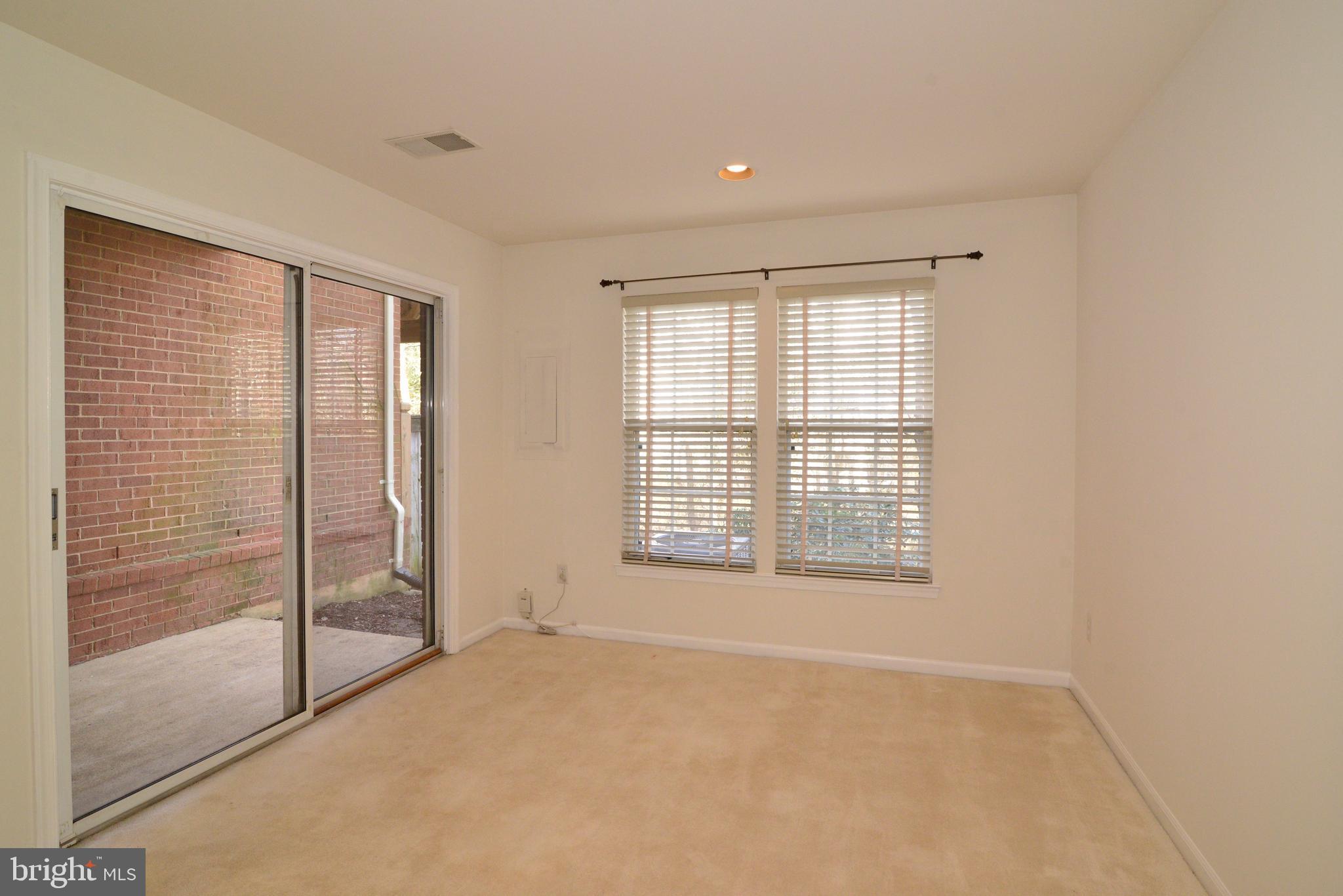 1384 Park Garden Lane Reston, VA 20194 - Photo 32 of 38 The den in the LL leads to the patio.