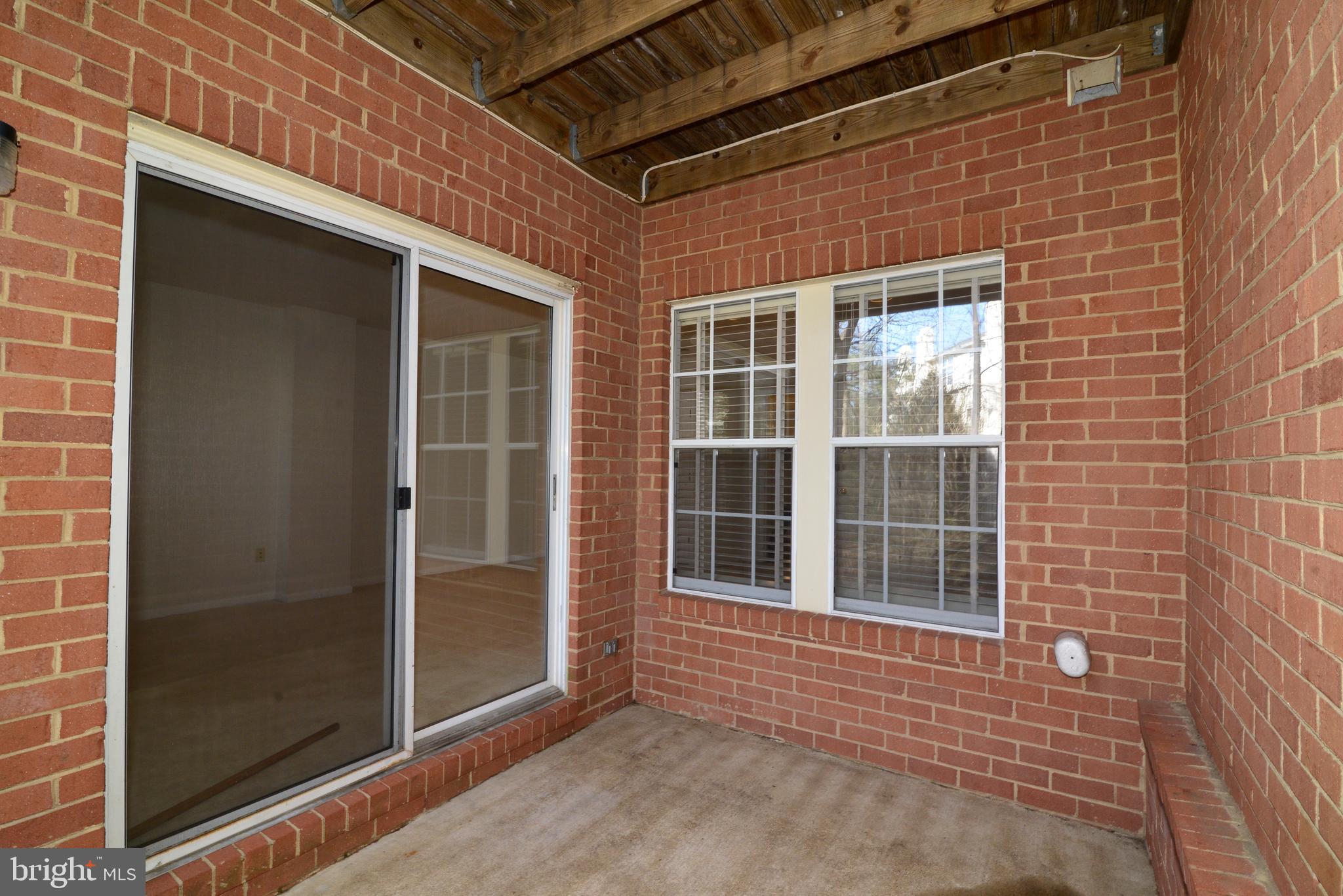 1384 Park Garden Lane Reston, VA 20194 - Photo 35 of 38 The patio leads into the bright lower level.