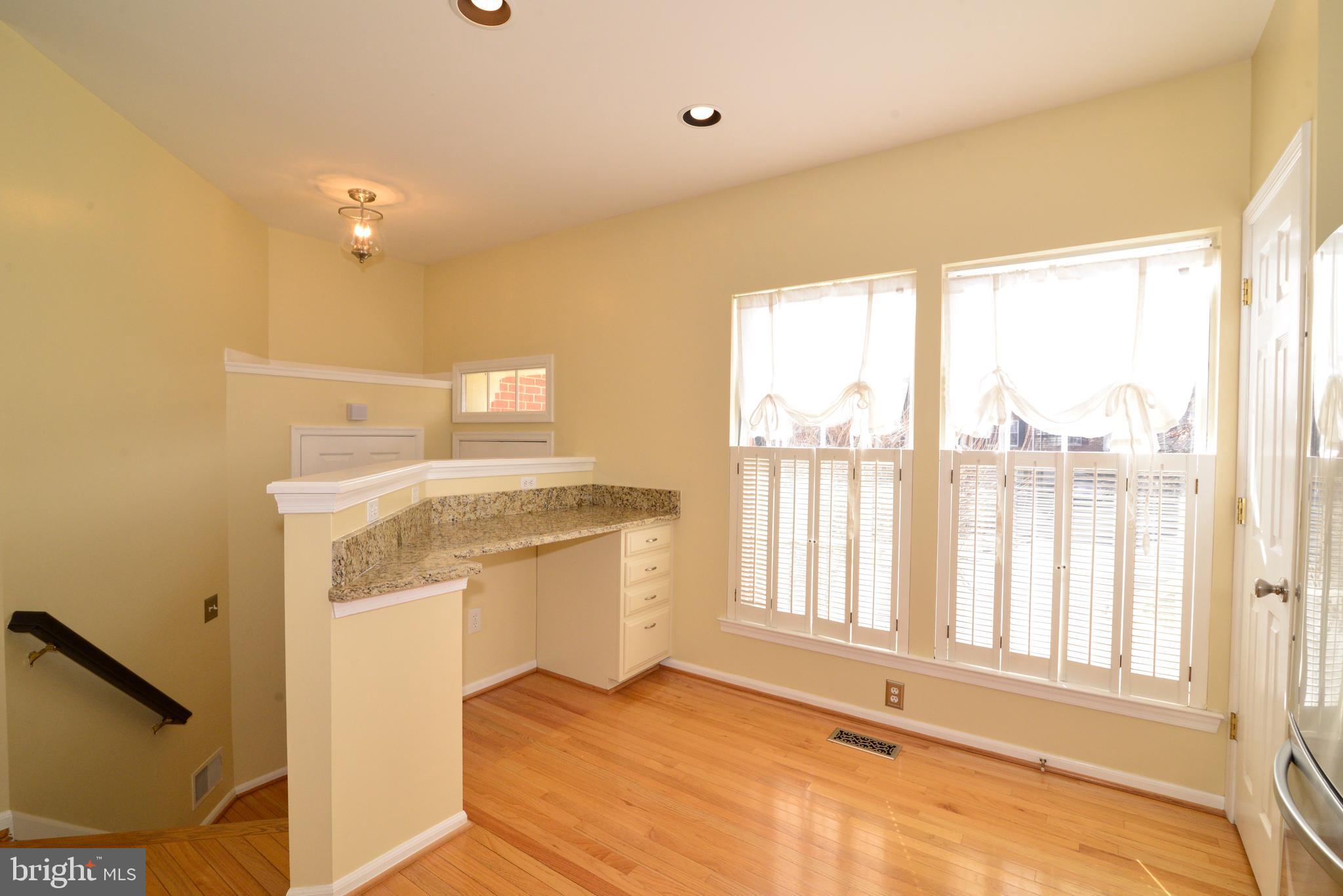 1384 Park Garden Lane Reston, VA 20194 - Photo 5 of 38 There is also a workstation and large windows.