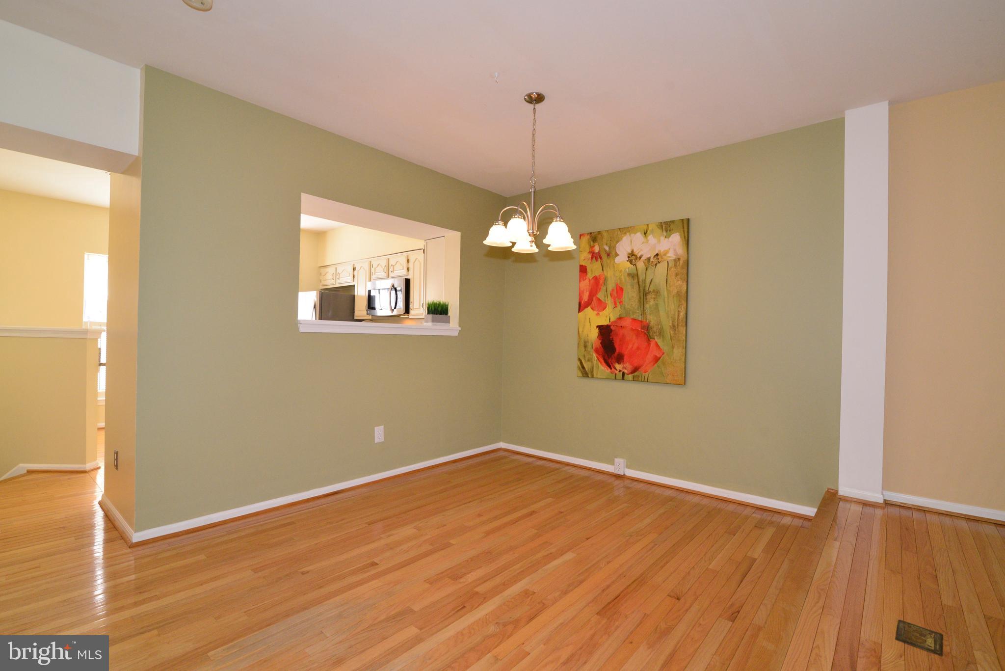1384 Park Garden Lane Reston, VA 20194 - Photo 7 of 38 The dining room has a pass-through to the kitchen.