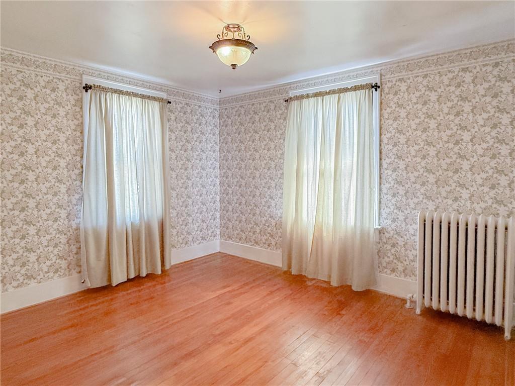 129 Missoura Street Somerset, PA 15501 - Photo 34 of 50 an empty room with wooden floor and a window