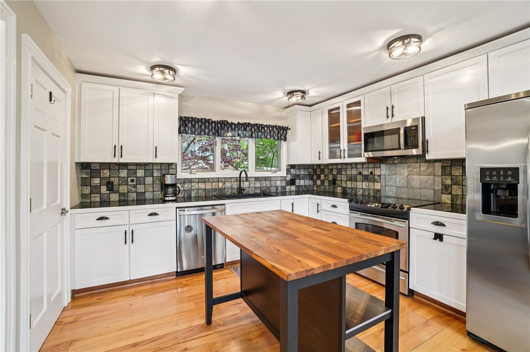 120 Beacon Ridge Circle Salem, SC 29676 - Photo 15 of 49 This bright kitchen features sleek appliances, ample cabinetry, and a charming kitchen island.
