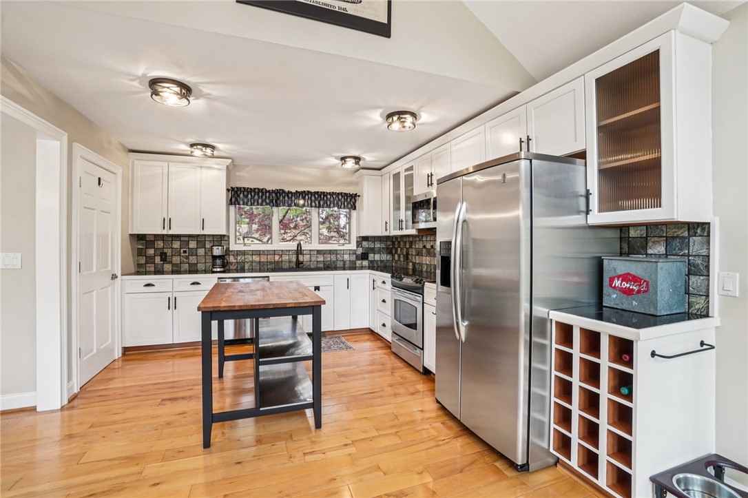 120 Beacon Ridge Circle Salem, SC 29676 - Photo 16 of 49 This bright kitchen features wood floors and modern appliances, perfect for everyday living.