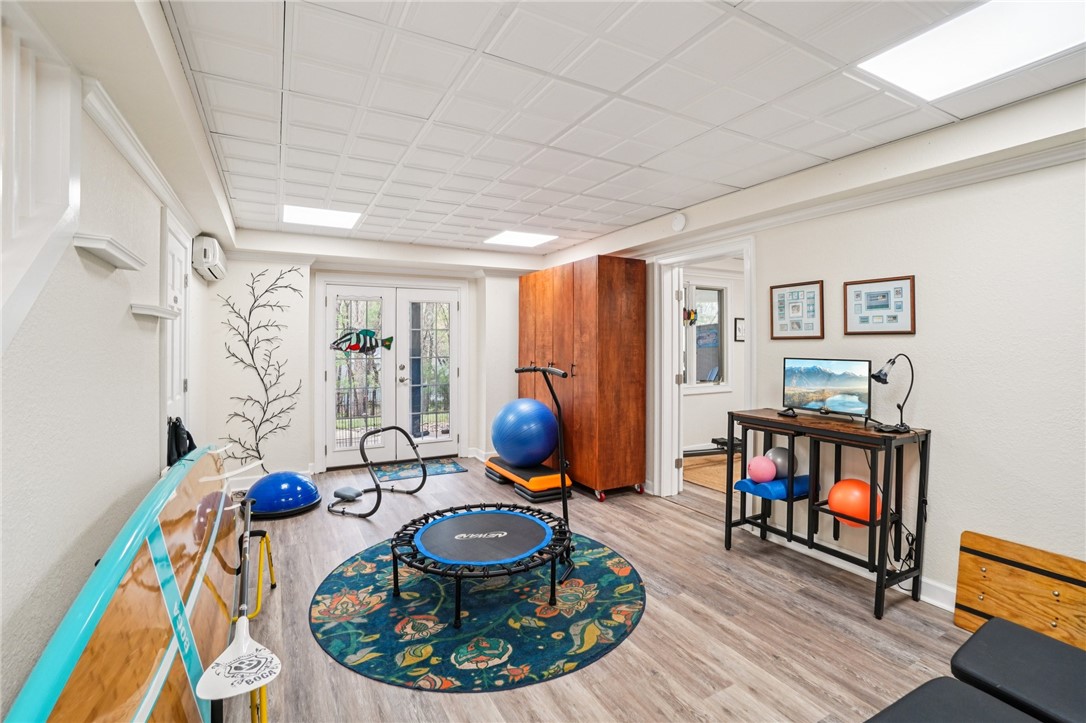 120 Beacon Ridge Circle Salem, SC 29676 - Photo 20 of 49 This versatile recreation room features French doors and wood flooring, ideal for various activities.