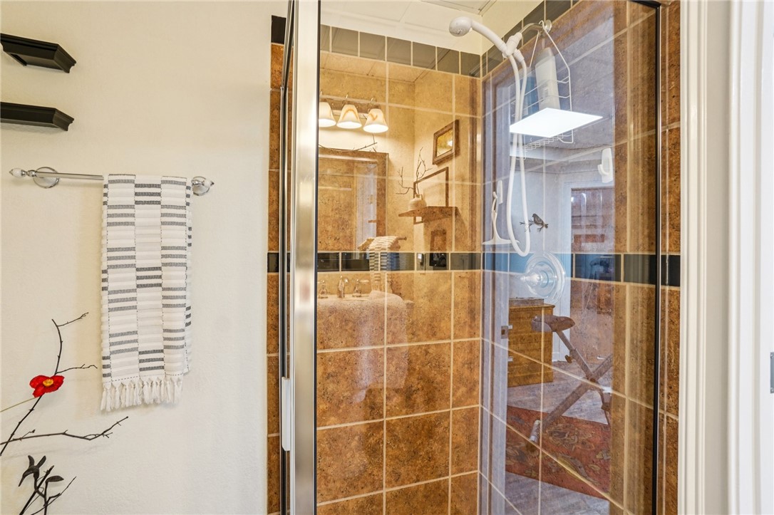 120 Beacon Ridge Circle Salem, SC 29676 - Photo 23 of 49 This bathroom features a shower with tiled walls and a glass enclosure, reflecting a bright and clean design.