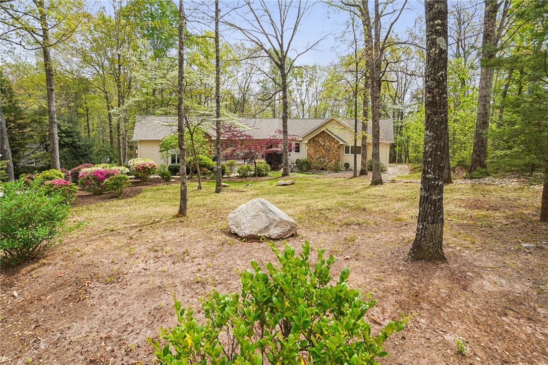 120 Beacon Ridge Circle Salem, SC 29676 - Photo 3 of 49 This charming residence is nestled within a verdant landscape, offering a serene and private living experience.