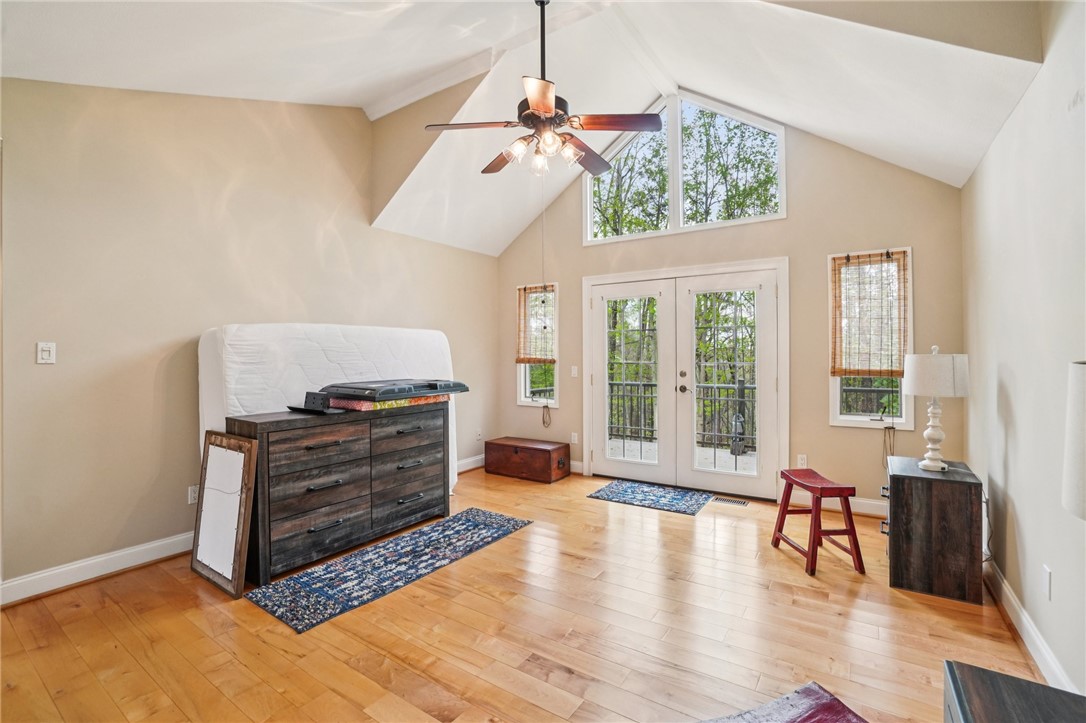 120 Beacon Ridge Circle Salem, SC 29676 - Photo 32 of 49 This airy room features vaulted ceilings, rich hardwood flooring, and expansive windows, leading to a private balcony.