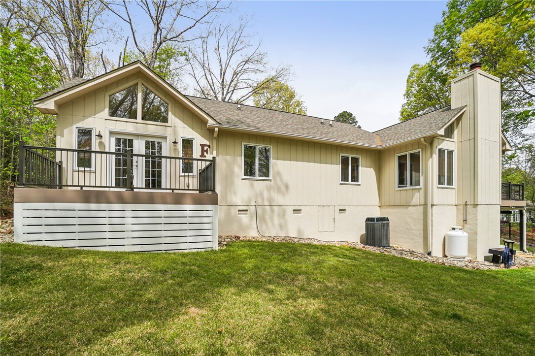 120 Beacon Ridge Circle Salem, SC 29676 - Photo 42 of 49 This inviting home offers an expansive back deck with ample outdoor space and mature trees.
