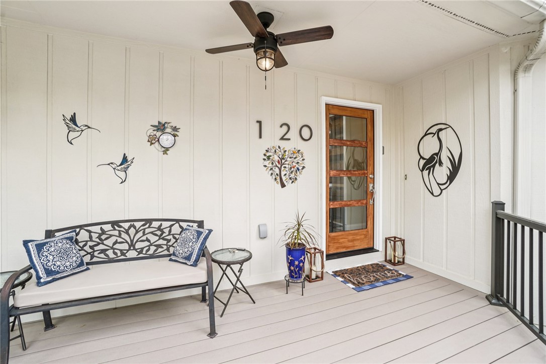 120 Beacon Ridge Circle Salem, SC 29676 - Photo 9 of 49 This inviting covered porch features a ceiling fan, offering a comfortable outdoor living space.