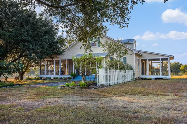 a view of a building with a yard