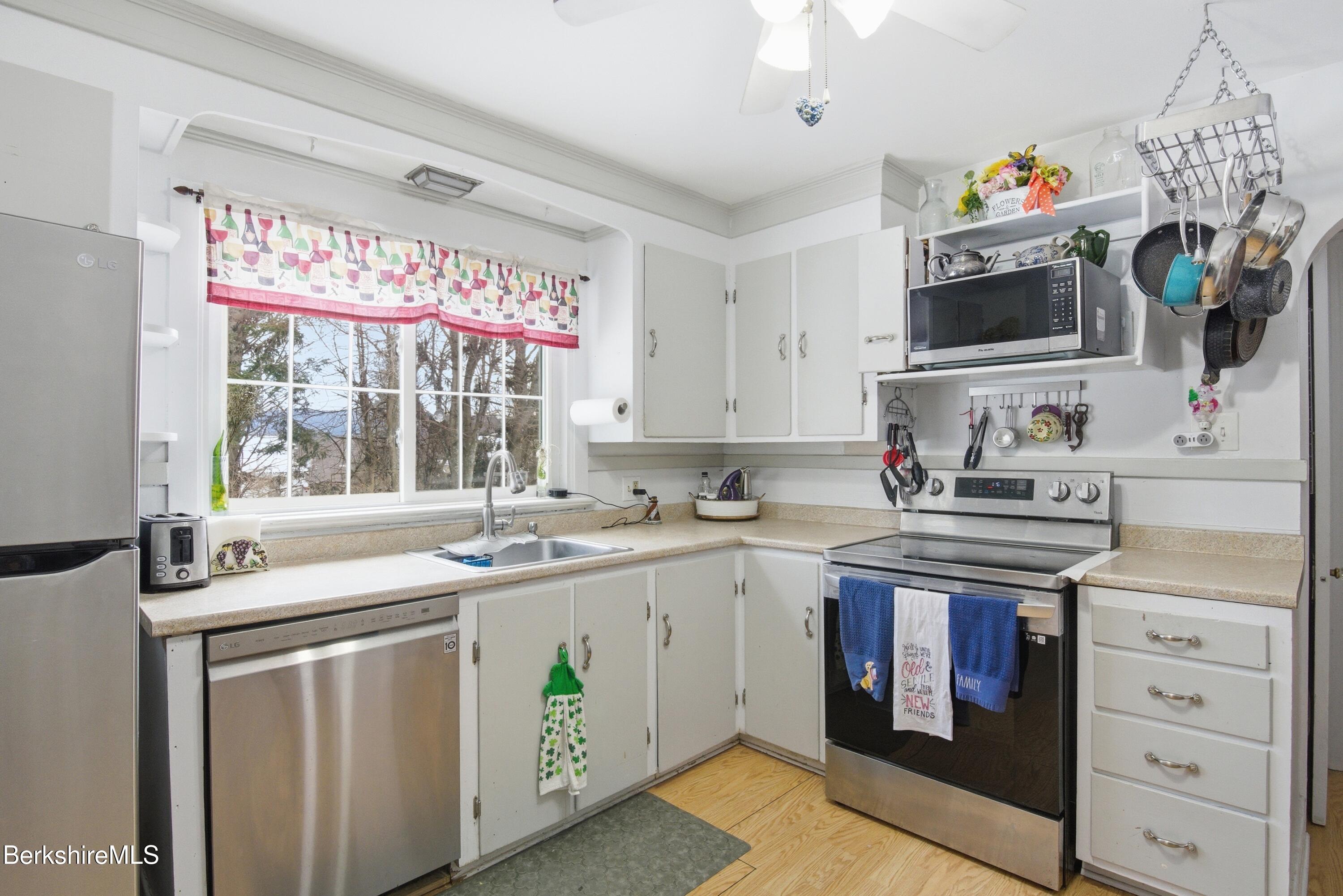 53 Edison Avenue Pittsfield, MA 01201 - Photo 13 of 45 a kitchen with stainless steel appliances granite countertop a sink and cabinets