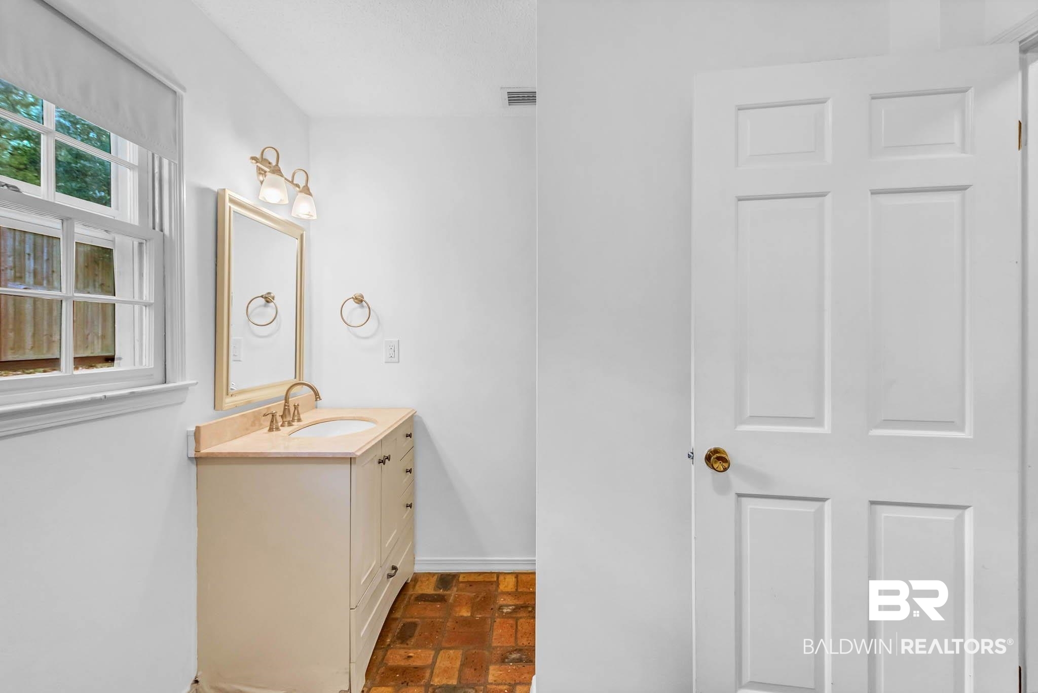 309 West Brandy Run Road Mobile, AL 36608 - Photo 62 of 100 Bathroom with brick flooring and vanity