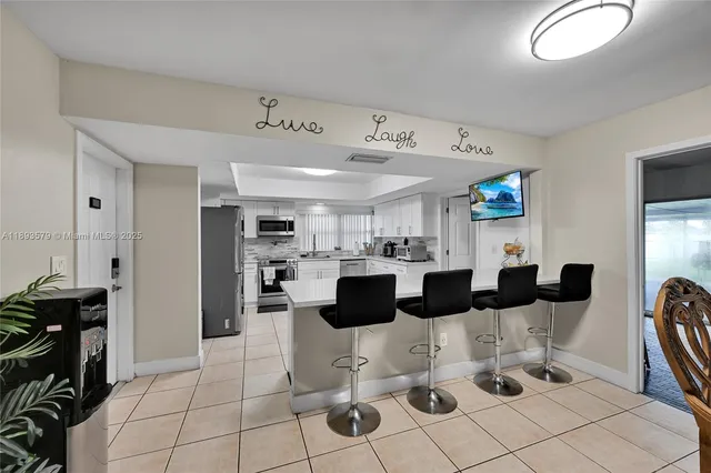 a view of kitchen and dining area with furniture