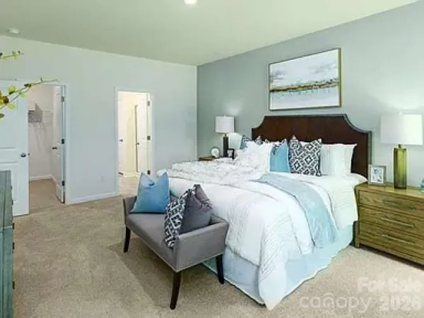 a bedroom with bed and a couch
