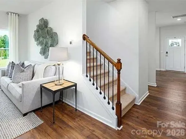 a view of a livingroom with furniture and wooden floor