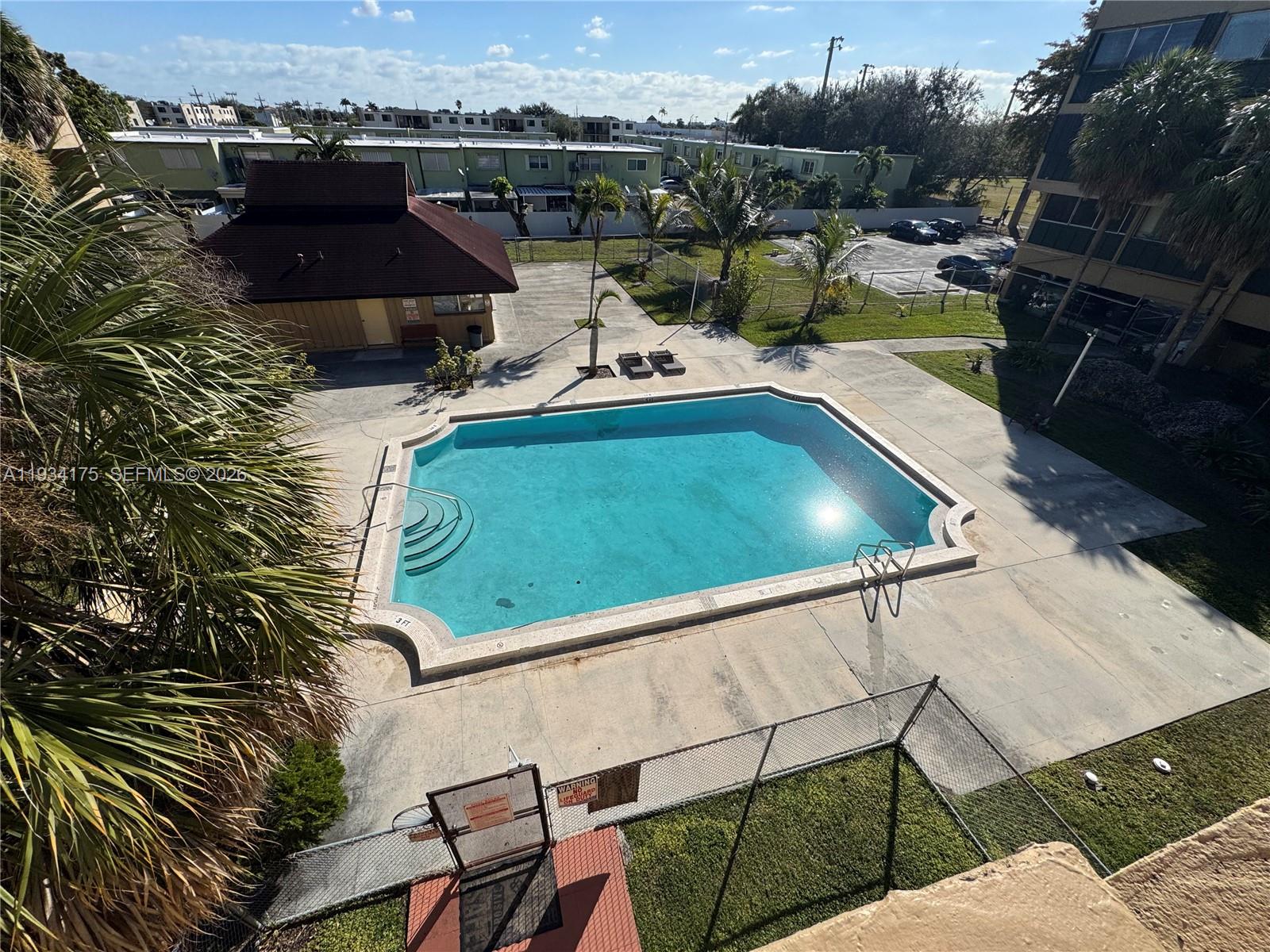 1750 West 56th Street, Unit 211 Hialeah, FL 33012 - Photo 19 of 19 a picture of a table and chairs