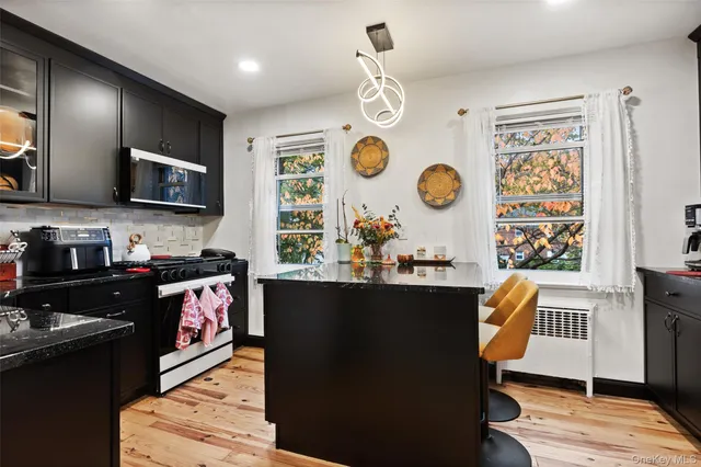 a kitchen with stainless steel appliances granite countertop a stove and a sink