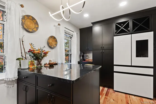 a kitchen with a sink and a refrigerator