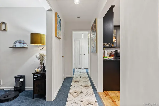 a view of a hallway view with staircase