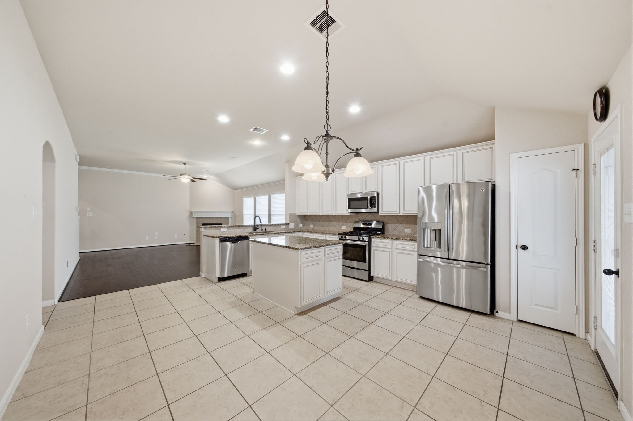 7611 Willow School Drive Spring, TX 77389 - Photo 10 of 23 a kitchen with a refrigerator sink and cabinets