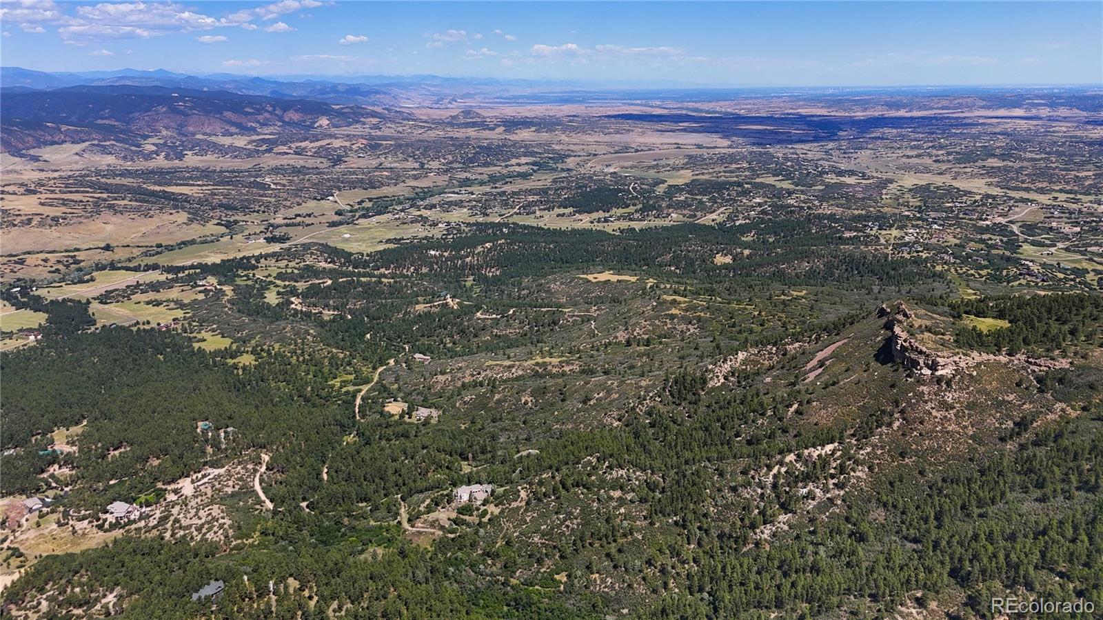 5080 South Perry Park Road Sedalia, CO 80135 - Photo 13 of 39 a view of a city with an ocean