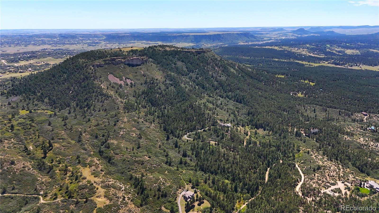 5080 South Perry Park Road Sedalia, CO 80135 - Photo 21 of 39 an aerial view of mountain with beach