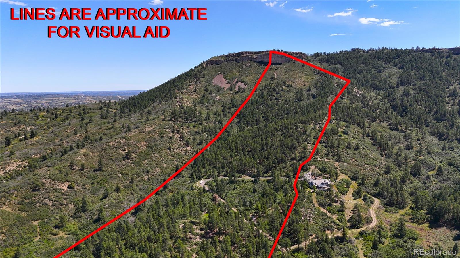 5080 South Perry Park Road Sedalia, CO 80135 - Photo 9 of 39 a close up of a road sign