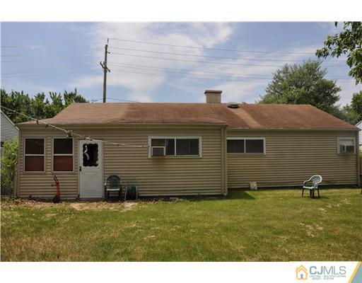 27 Colton Road Edison, NJ 08817 - Photo 2 of 9 a backyard of a house with barbeque oven