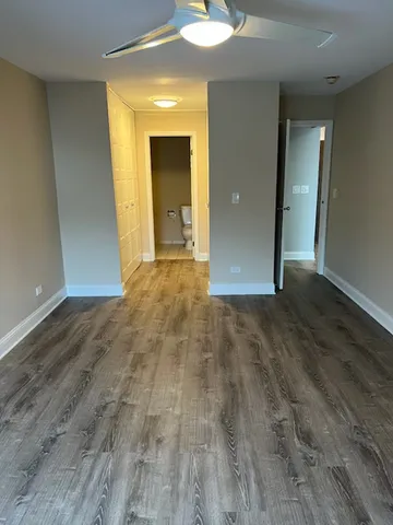 wooden floor in an empty room with a mirror