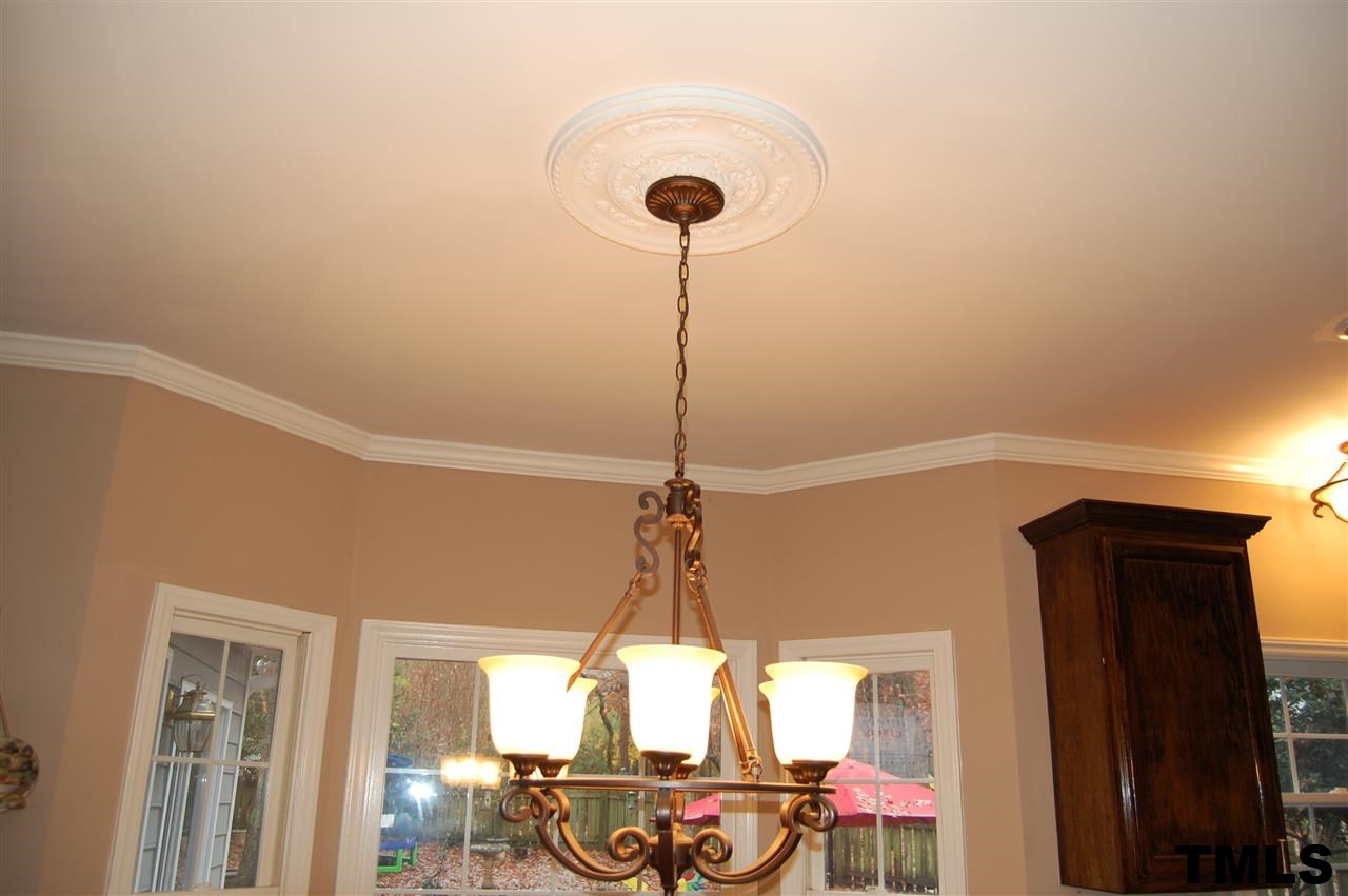 9505 Meadowmont Lane Raleigh, NC 27615 - Photo 11 of 18 a very nice looking room with a chandelier