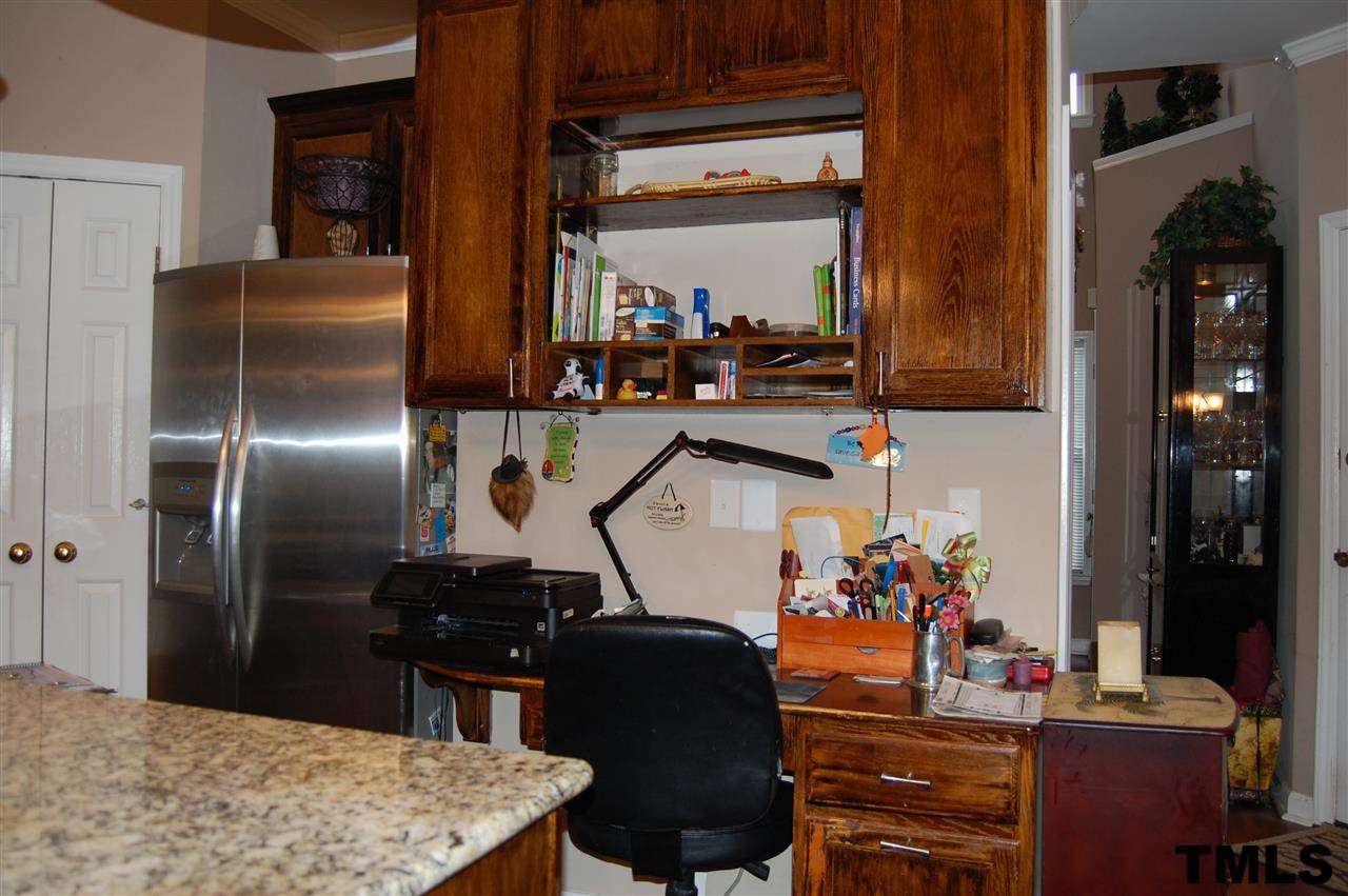 9505 Meadowmont Lane Raleigh, NC 27615 - Photo 16 of 18 a kitchen area with granite countertop stainless steel appliances and sink