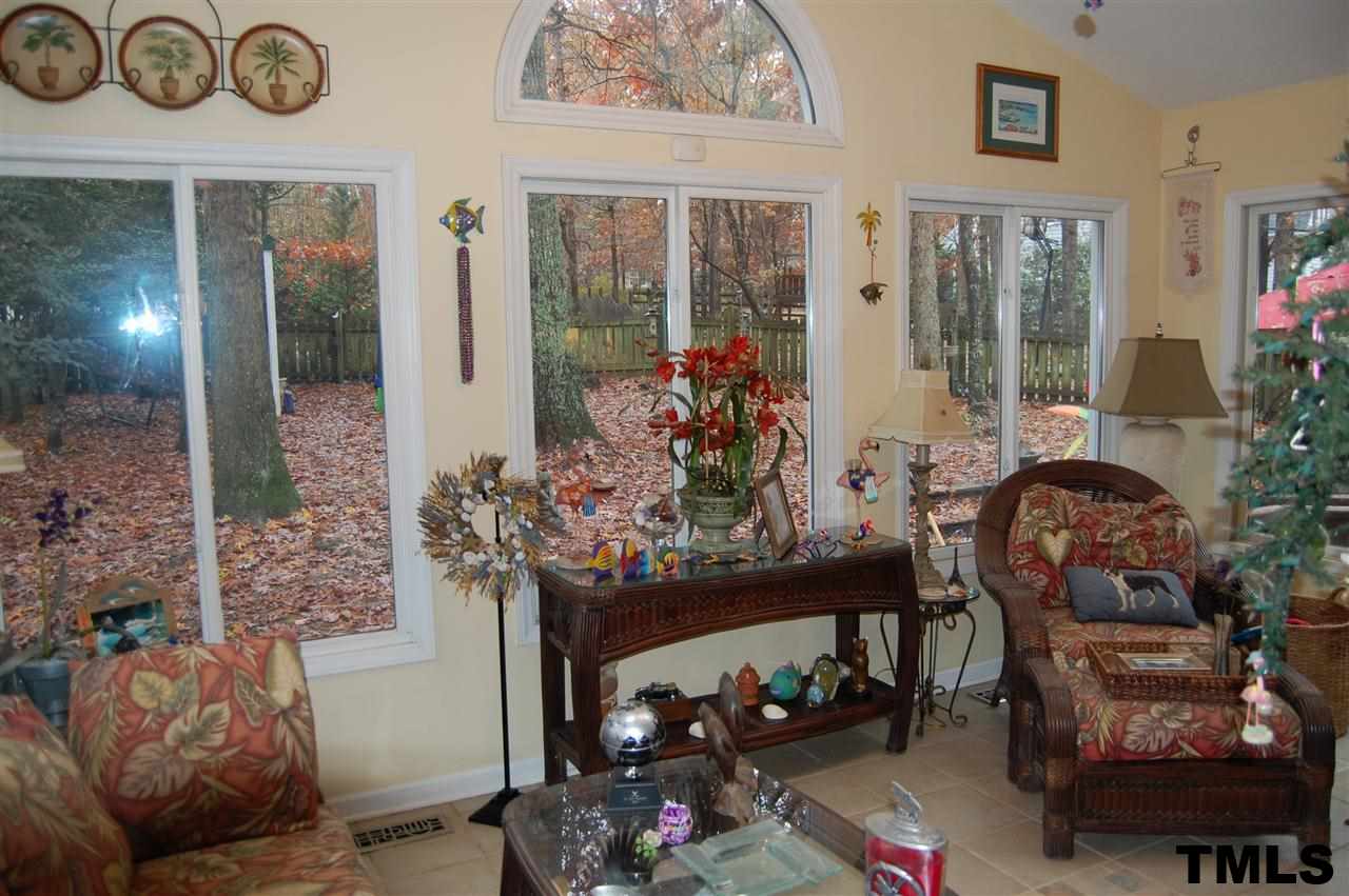 9505 Meadowmont Lane Raleigh, NC 27615 - Photo 18 of 18 a living room with furniture and flowers