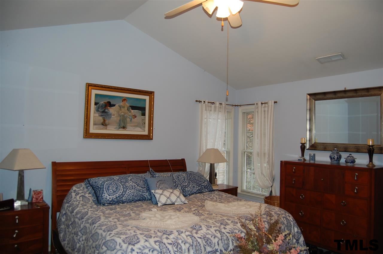 9505 Meadowmont Lane Raleigh, NC 27615 - Photo 8 of 18 a bedroom with bed and window