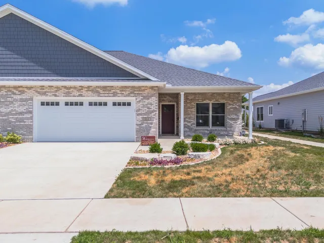 a view of an house with backyard space and balcony