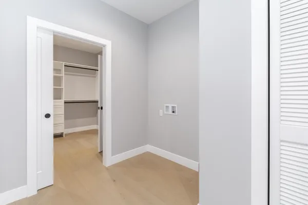 wooden floor with white walls