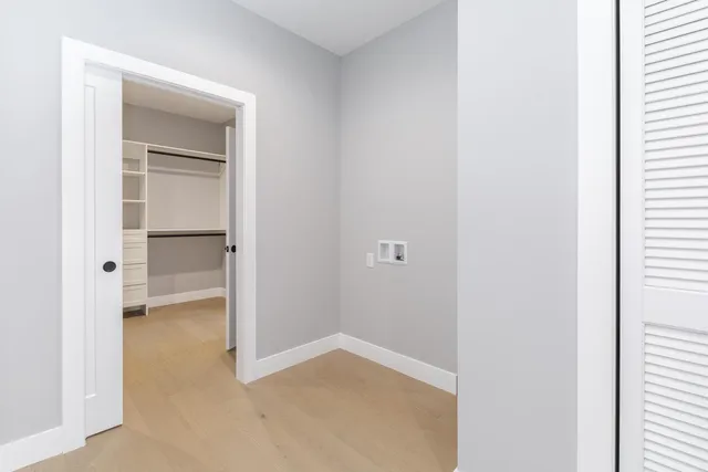 wooden floor with white walls