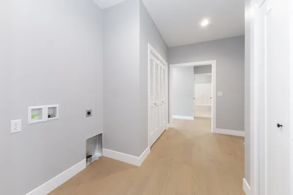 a view of a kitchen and a window in the room