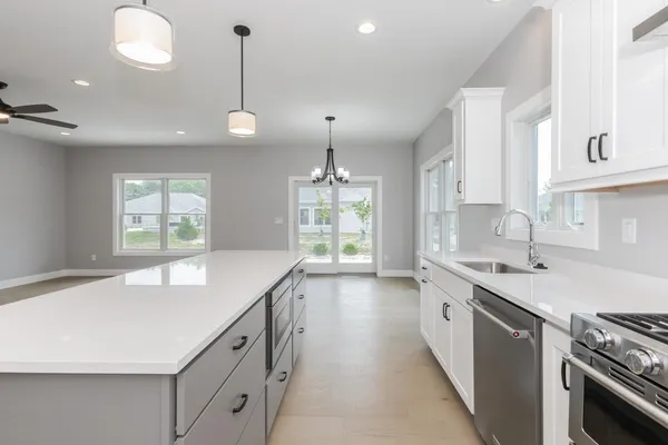 a view of a room with windows and entryway