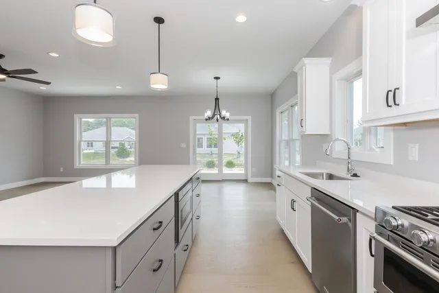 a view of a room with windows and entryway