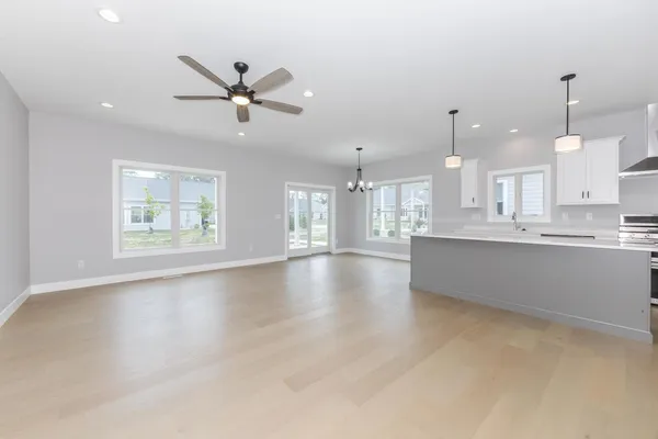 a view of a kitchen with a stove cabinets and wooden floor